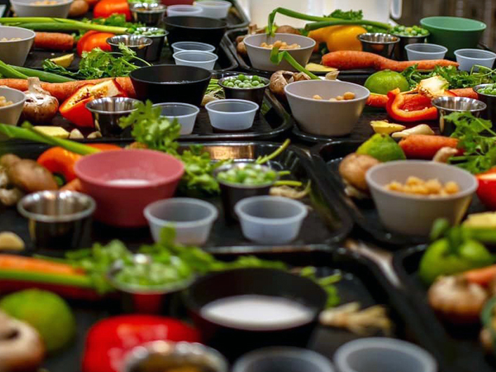 Trays of ingredients as Mise en Place, the French term for preparing the ingredients portioned out before cooking.